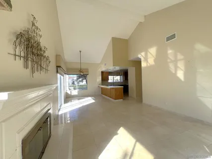 a view of a livingroom with furniture and a fireplace
