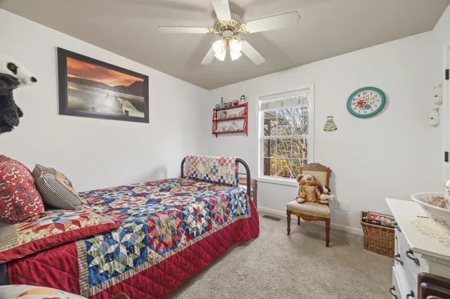 a bedroom with a bed and a couch