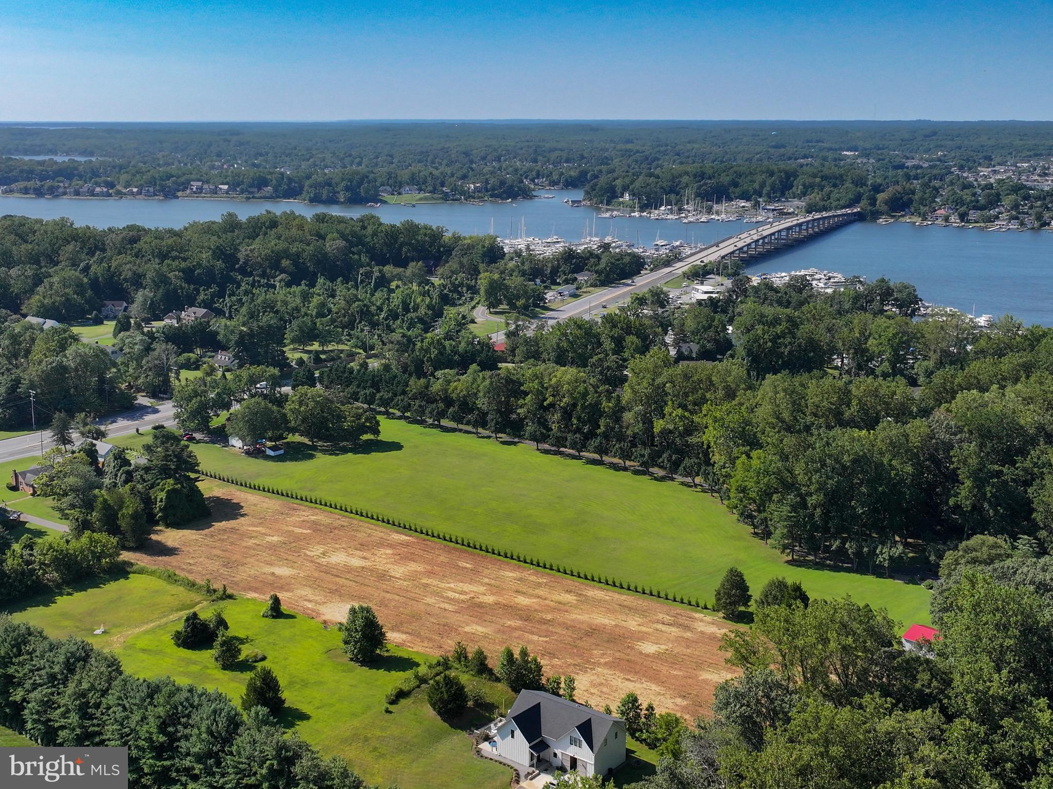 67 Wallace Manor Road Edgewater, MD 21037 - Photo 31 of 36 an aerial view of a city with lots of residential buildings and mountain view in back