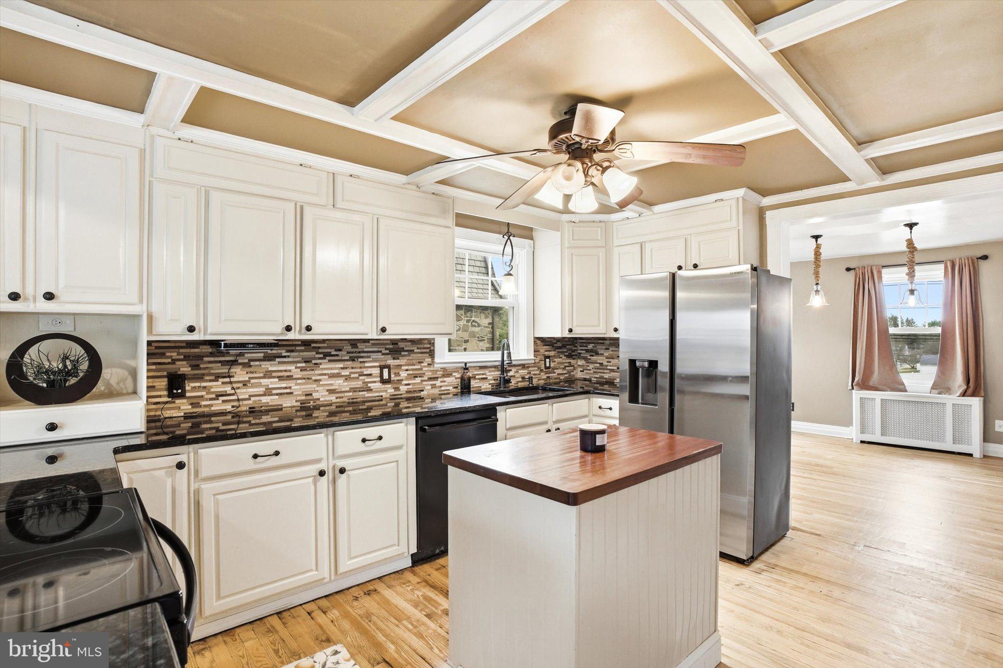 30 Upper Ferry Road Ewing, NJ 08628 - Photo 8 of 29 a kitchen with a refrigerator a stove cabinets and wooden floor