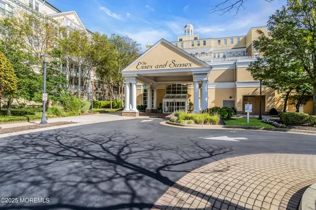 a living room with fireplace furniture and a large window
