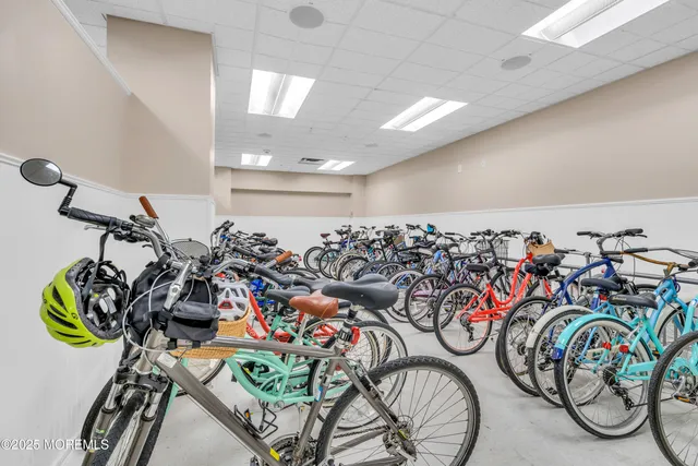 a living room with furniture a fireplace and a chandelier