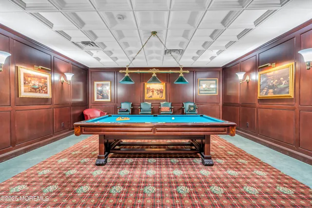 a kitchen with stainless steel appliances granite countertop a kitchen island a stove a table and chairs in it