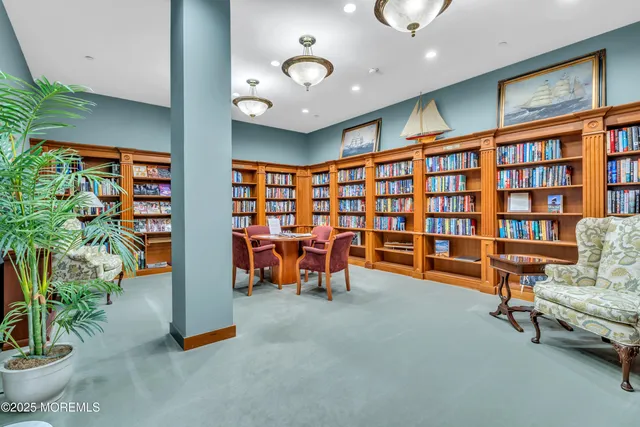 a large room with lots of chairs and a rug