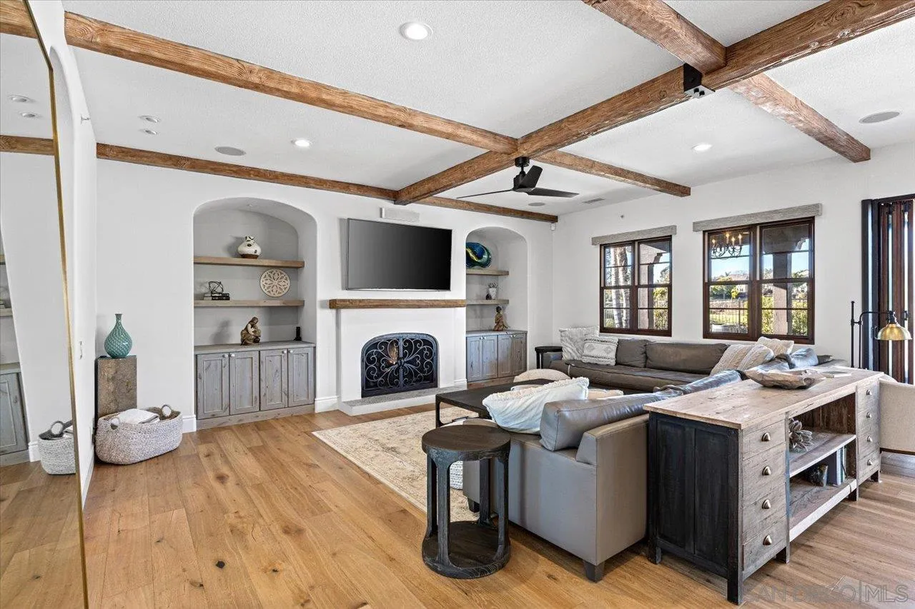 1202 Via Zamia Encinitas, CA 92024 - Photo 14 of 41 a living room with furniture fireplace and flat screen tv