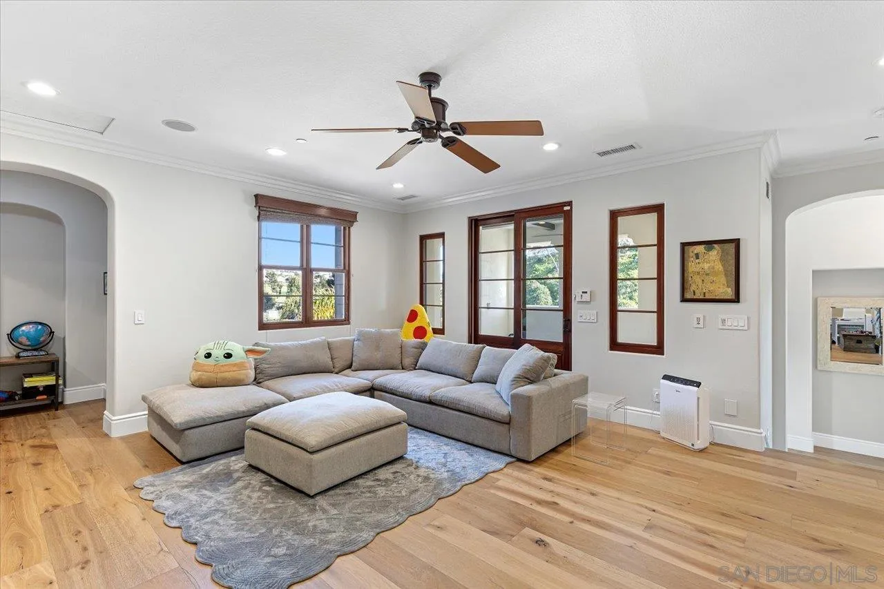 1202 Via Zamia Encinitas, CA 92024 - Photo 17 of 41 a living room with furniture and a large window
