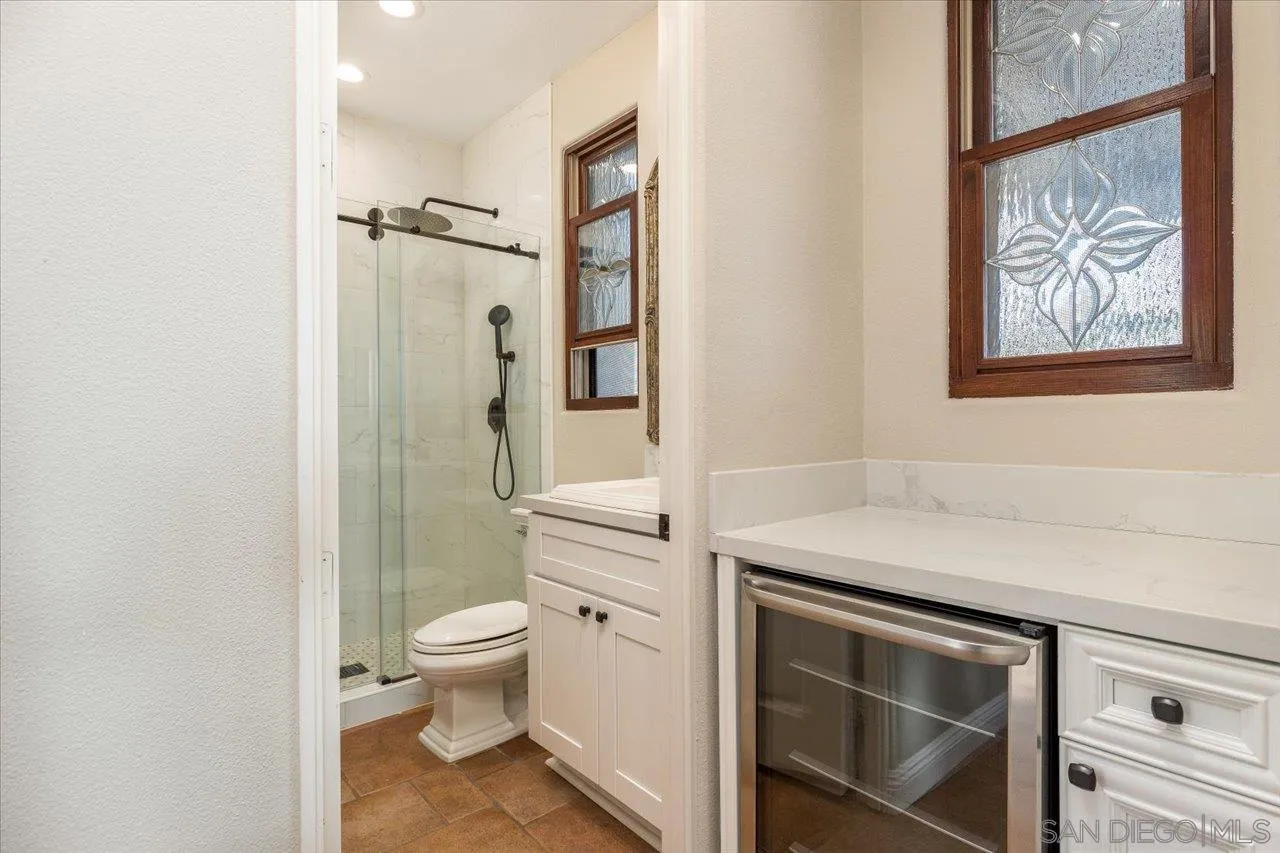 1202 Via Zamia Encinitas, CA 92024 - Photo 24 of 41 a bathroom with a sink toilet and shower