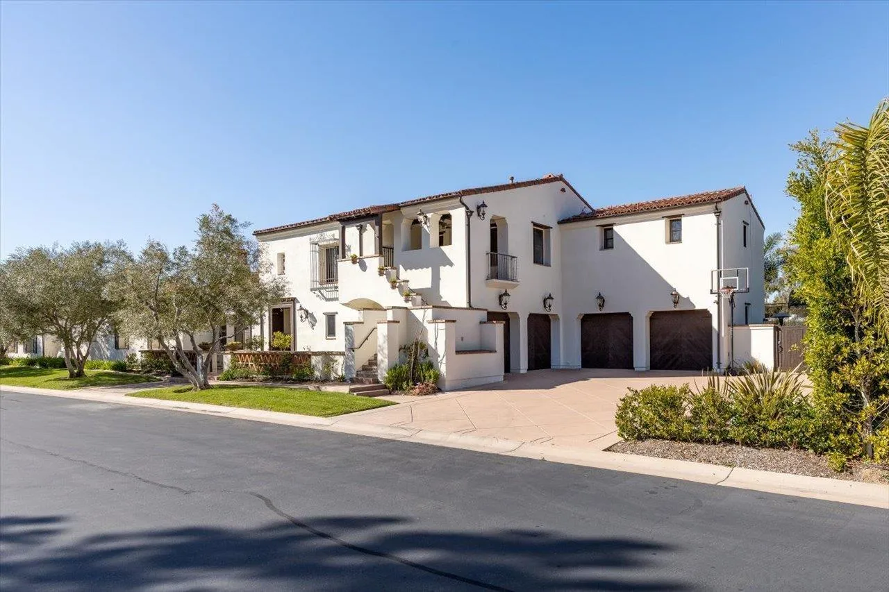 1202 Via Zamia Encinitas, CA 92024 - Photo 39 of 41 a front view of a house with a yard and garage