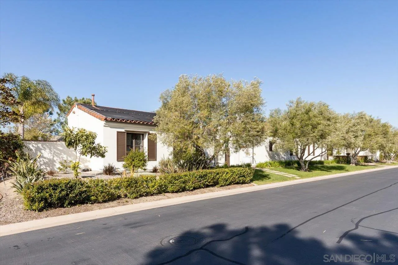 1202 Via Zamia Encinitas, CA 92024 - Photo 41 of 41 a front view of a house with a yard and garage