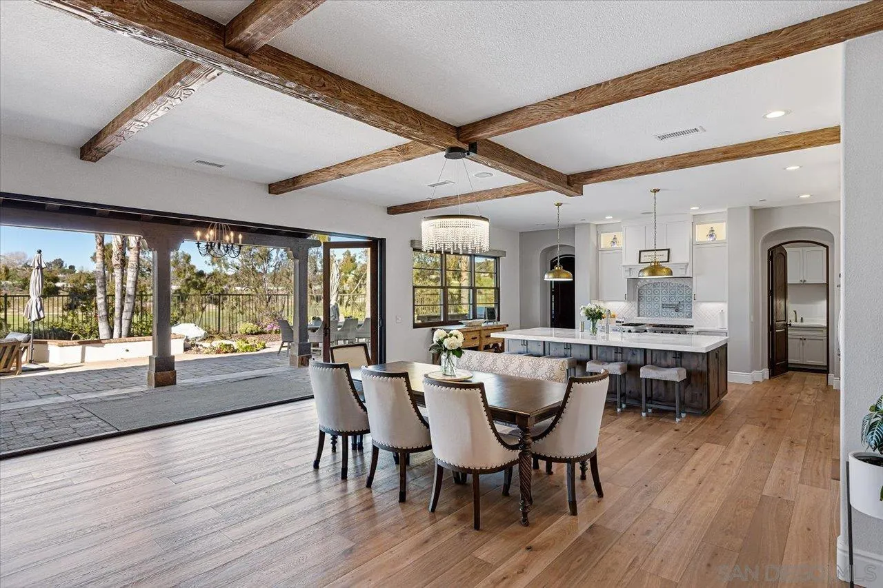 1202 Via Zamia Encinitas, CA 92024 - Photo 7 of 41 a view of a dining room with furniture window and wooden floor