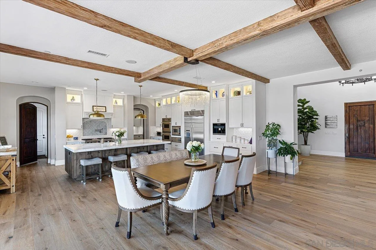 1202 Via Zamia Encinitas, CA 92024 - Photo 8 of 41 a view of a dining room with furniture and wooden floor