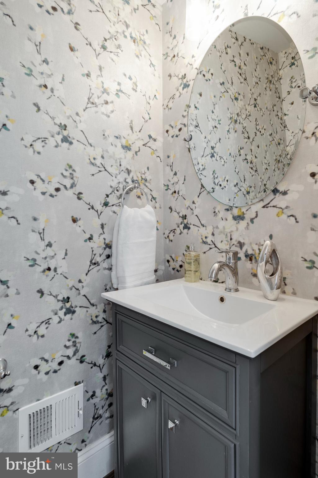 3616 T Street Northwest Washington, DC 20007 - Photo 13 of 49 a bathroom with a sink and a mirror