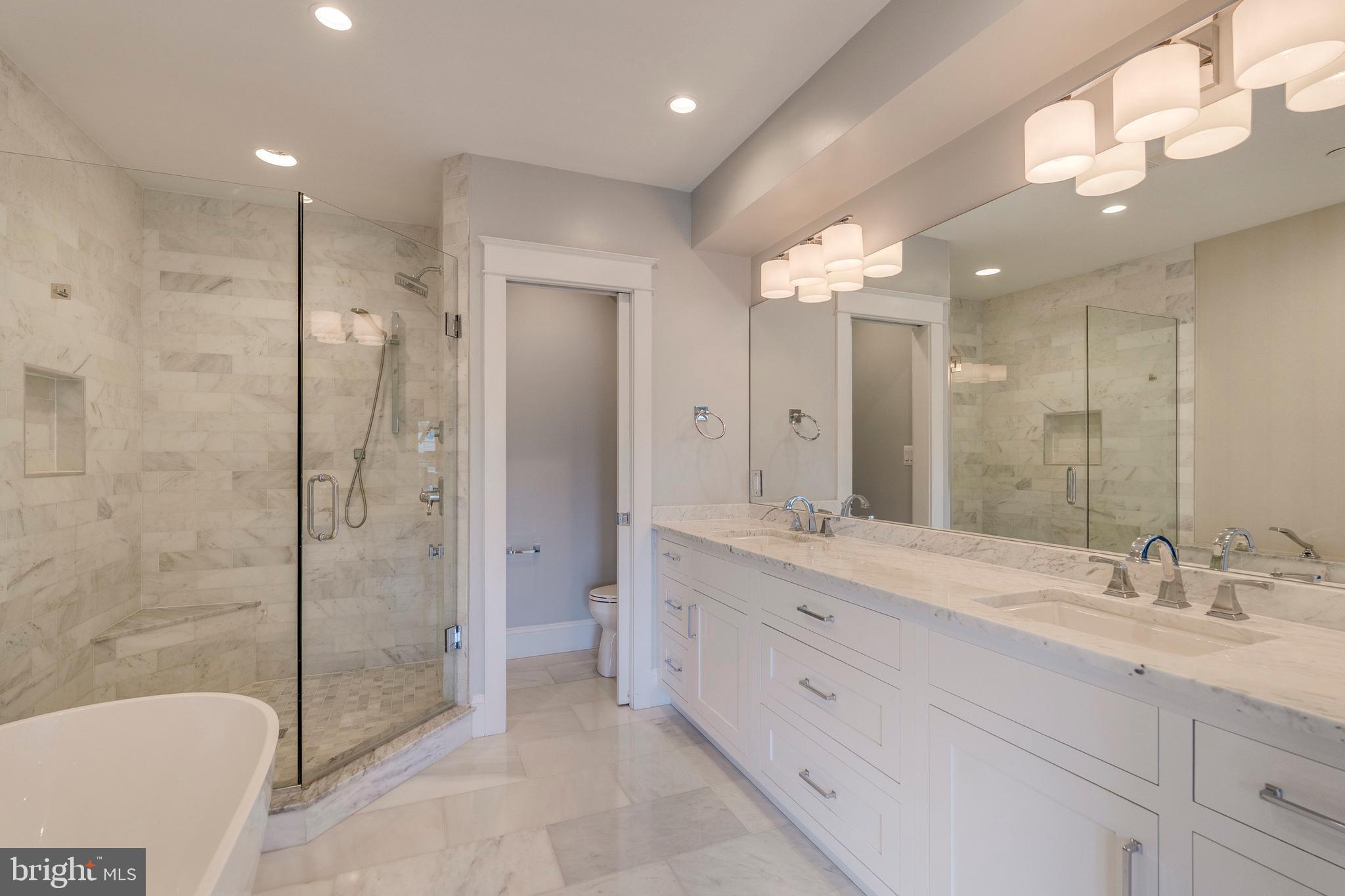 3616 T Street Northwest Washington, DC 20007 - Photo 17 of 49 a spacious bathroom with a granite countertop sink mirror and shower