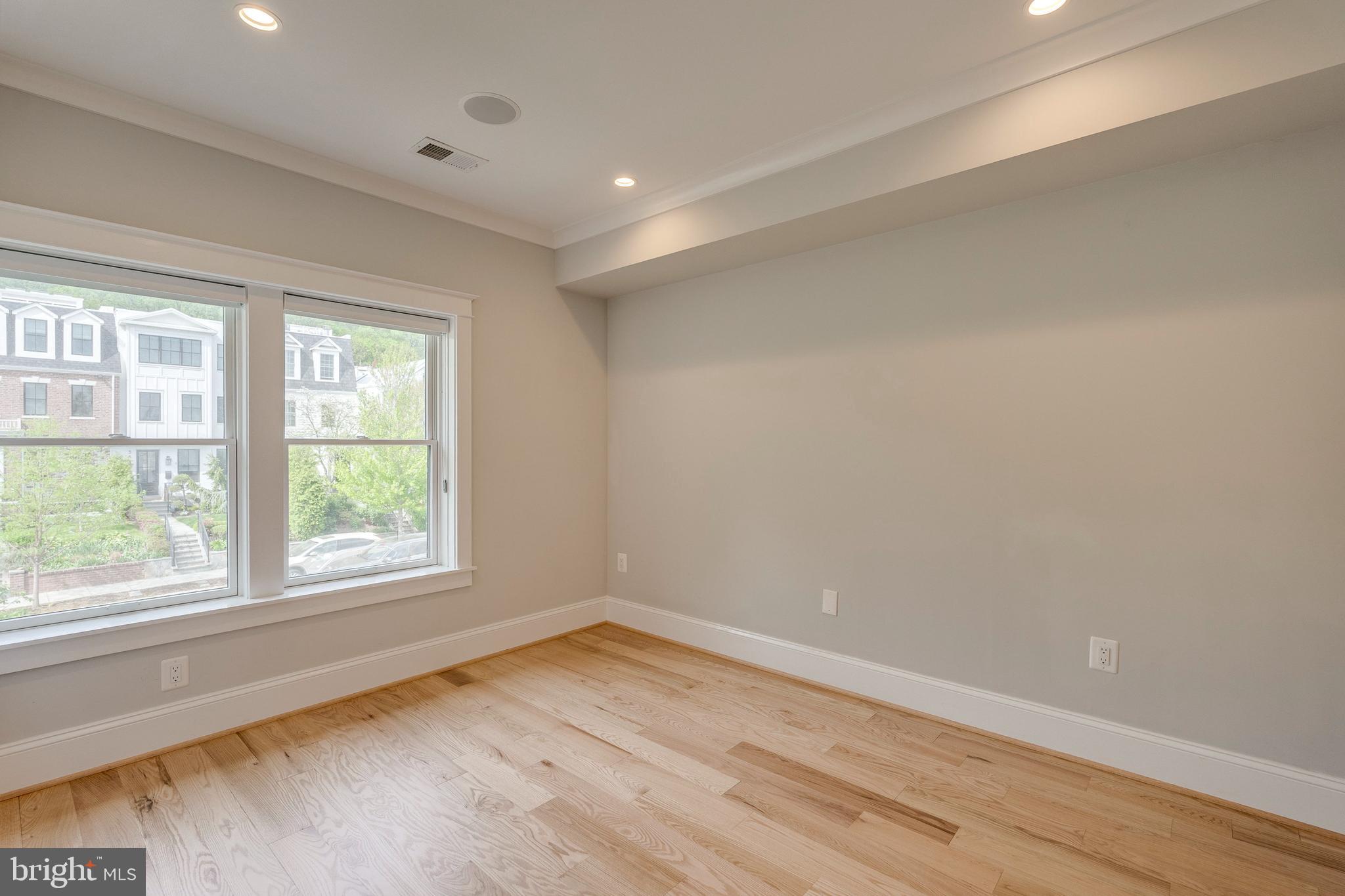 3616 T Street Northwest Washington, DC 20007 - Photo 22 of 49 an empty room with wooden floor and windows