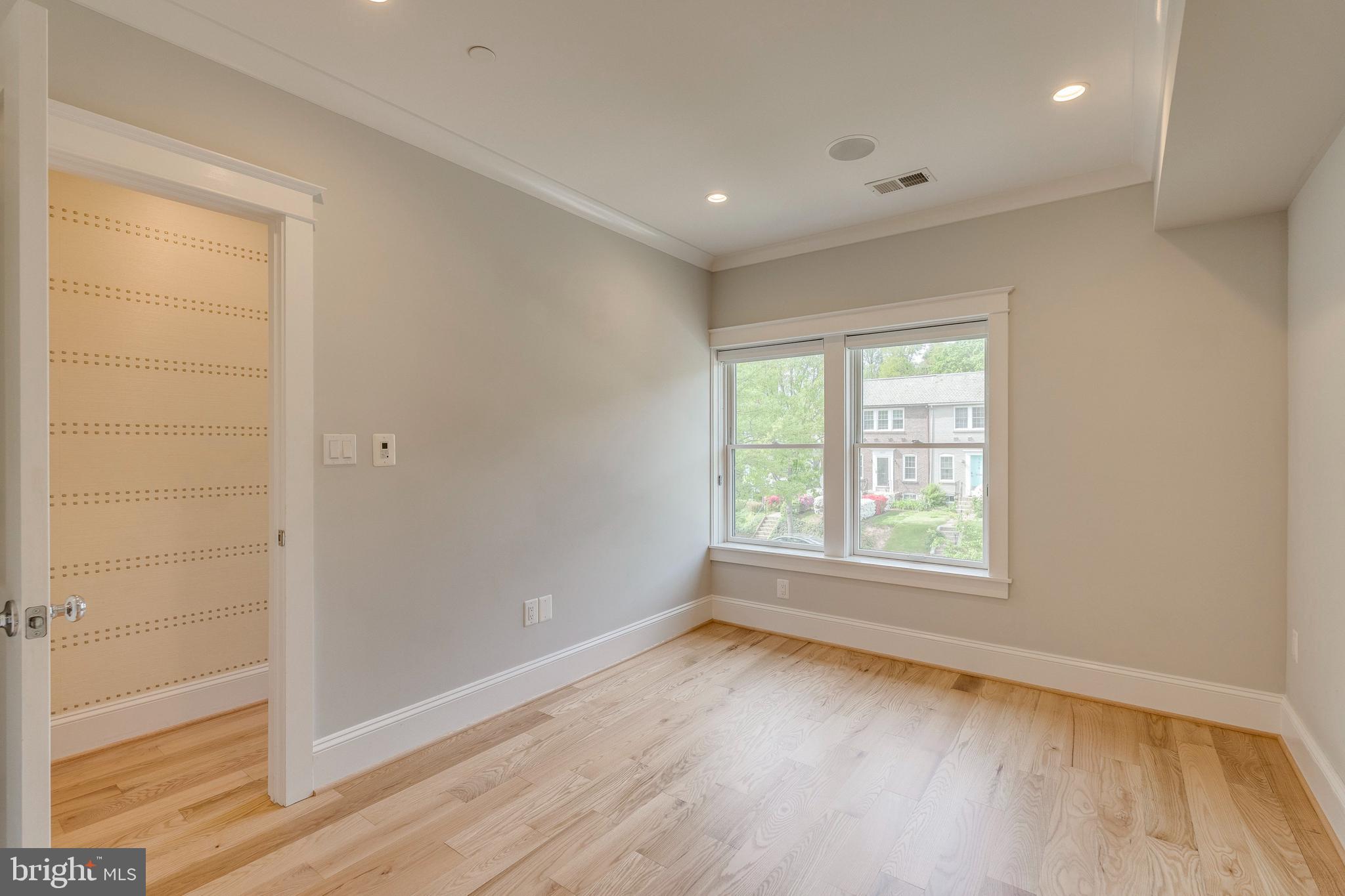 3616 T Street Northwest Washington, DC 20007 - Photo 23 of 49 an empty room with wooden floor and windows