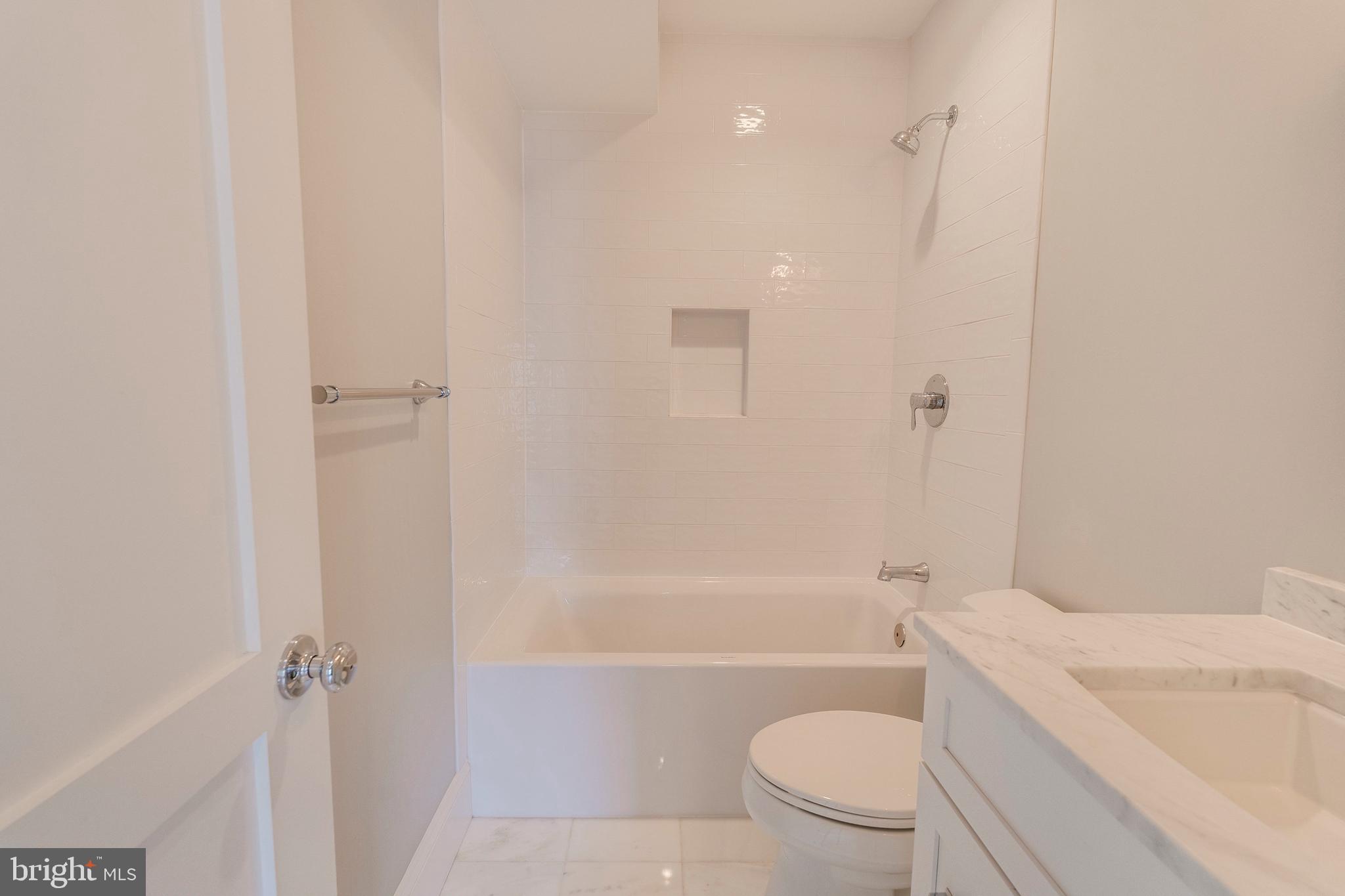 3616 T Street Northwest Washington, DC 20007 - Photo 26 of 49 a bathroom with a sink a toilet and shower