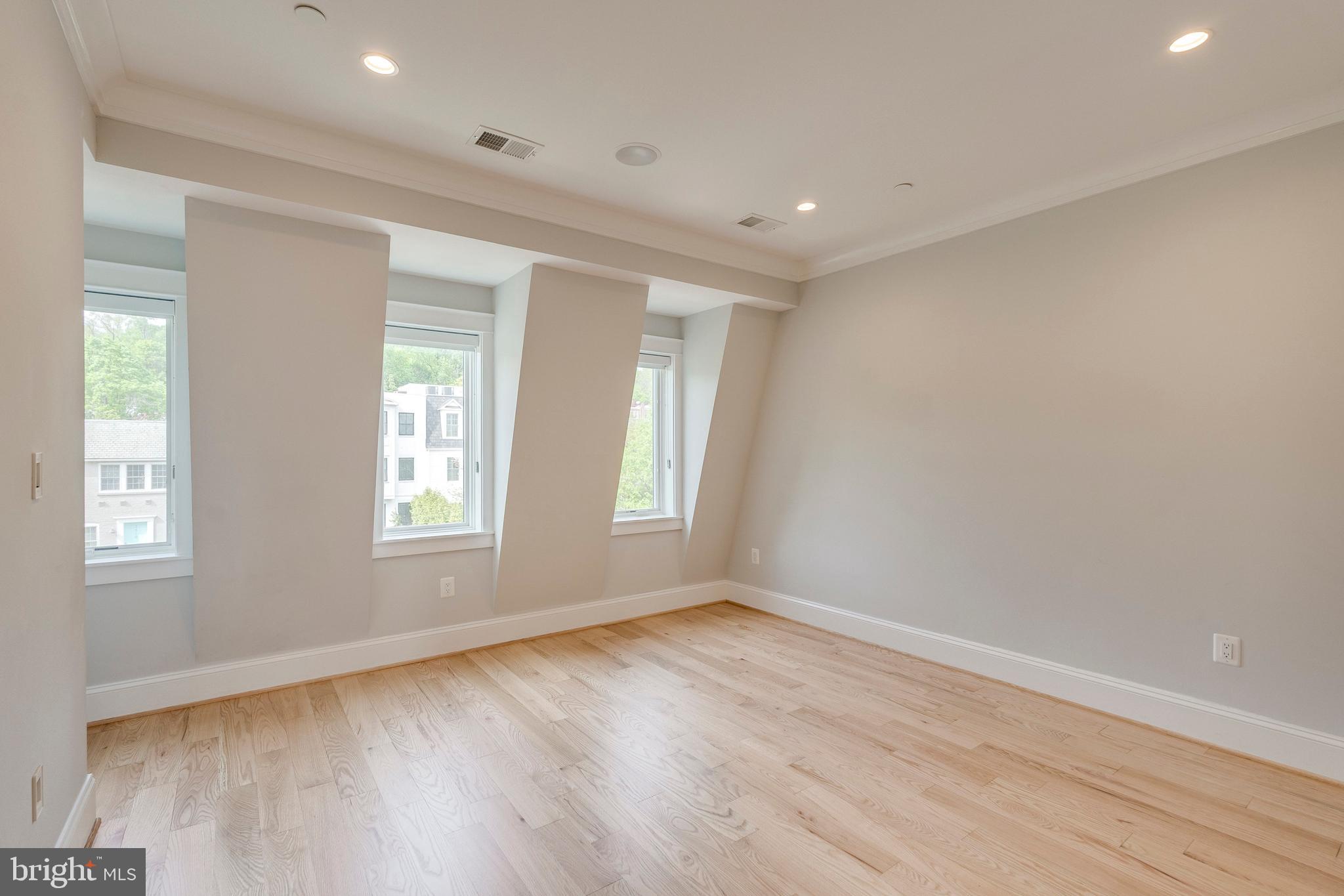 3616 T Street Northwest Washington, DC 20007 - Photo 27 of 49 a view of empty room with wooden floor and fan