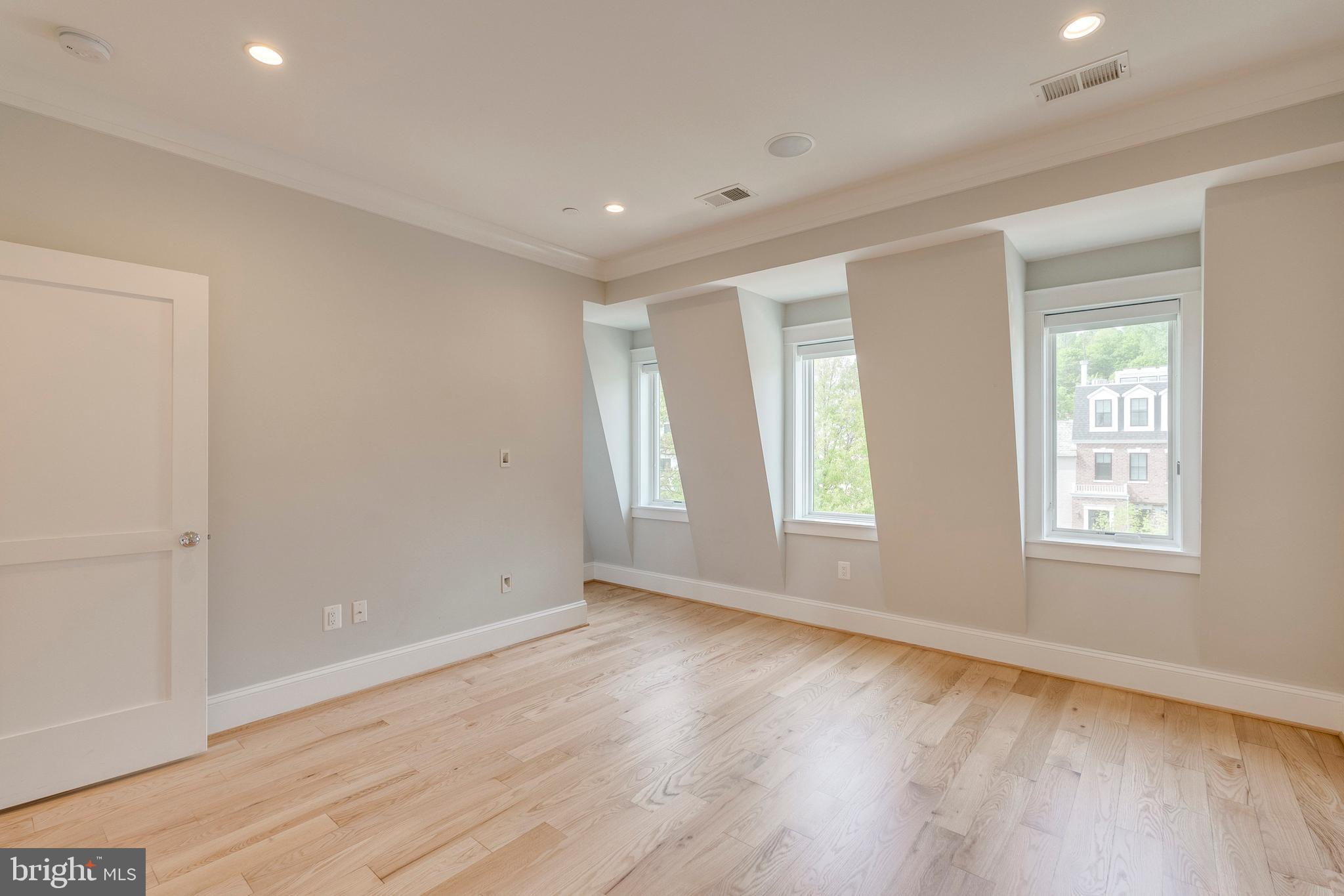 3616 T Street Northwest Washington, DC 20007 - Photo 28 of 49 a view of empty room with wooden floor and fan