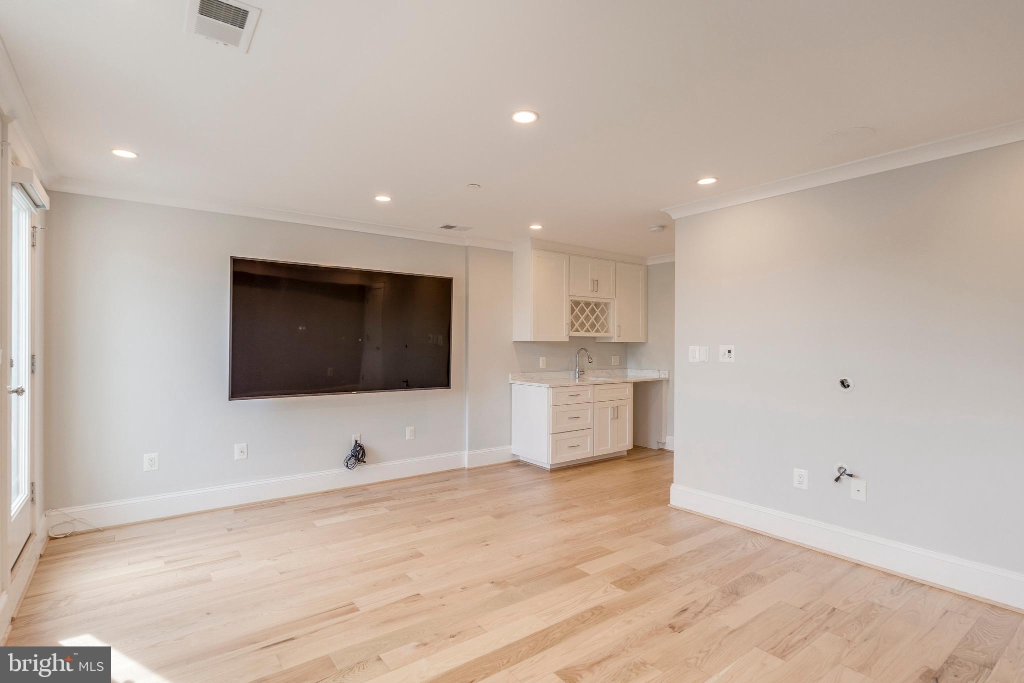 3616 T Street Northwest Washington, DC 20007 - Photo 32 of 49 a view of kitchen with wooden floor and electronic appliances