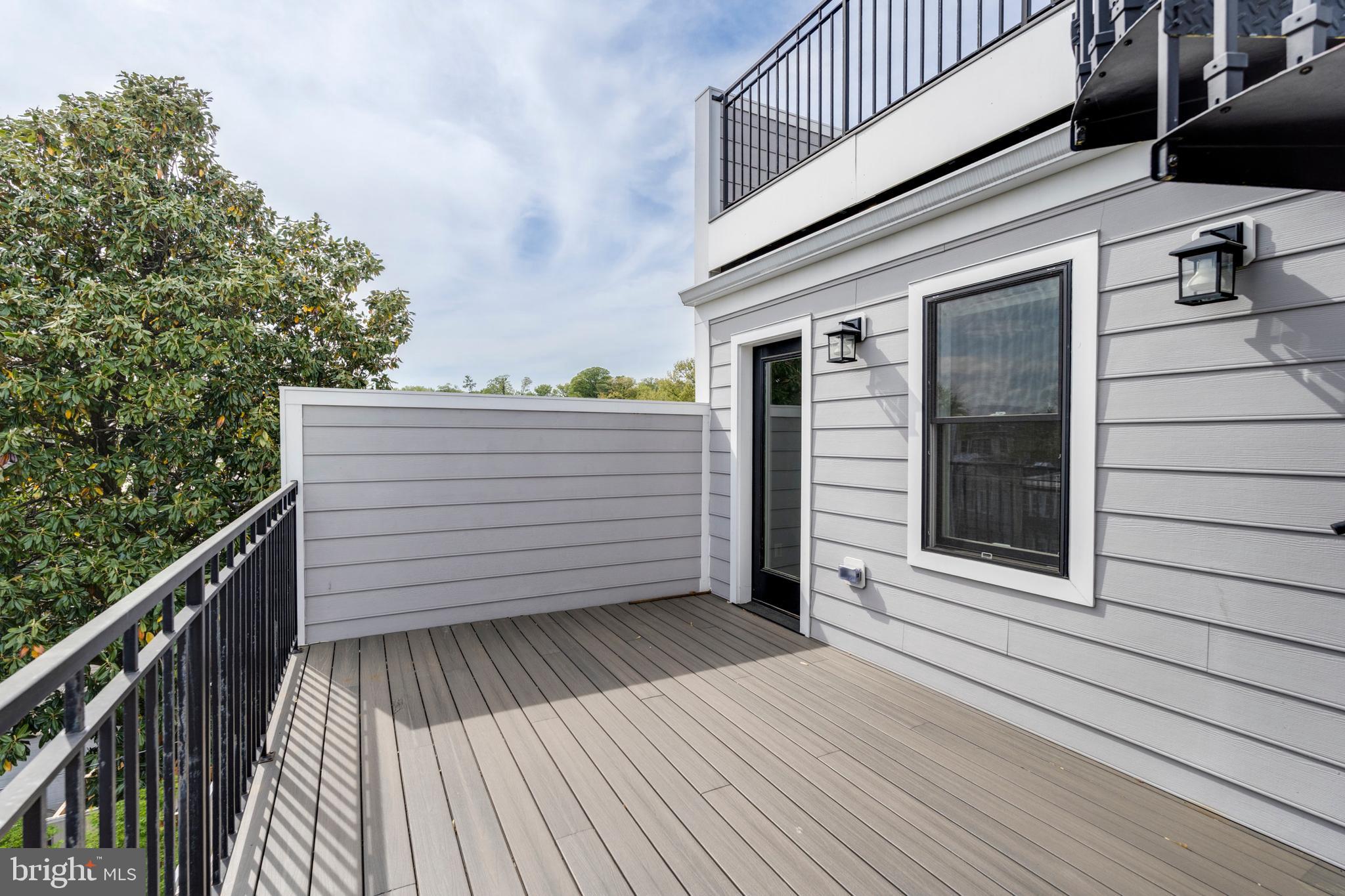 3616 T Street Northwest Washington, DC 20007 - Photo 36 of 49 a view of a balcony with wooden floor and fence