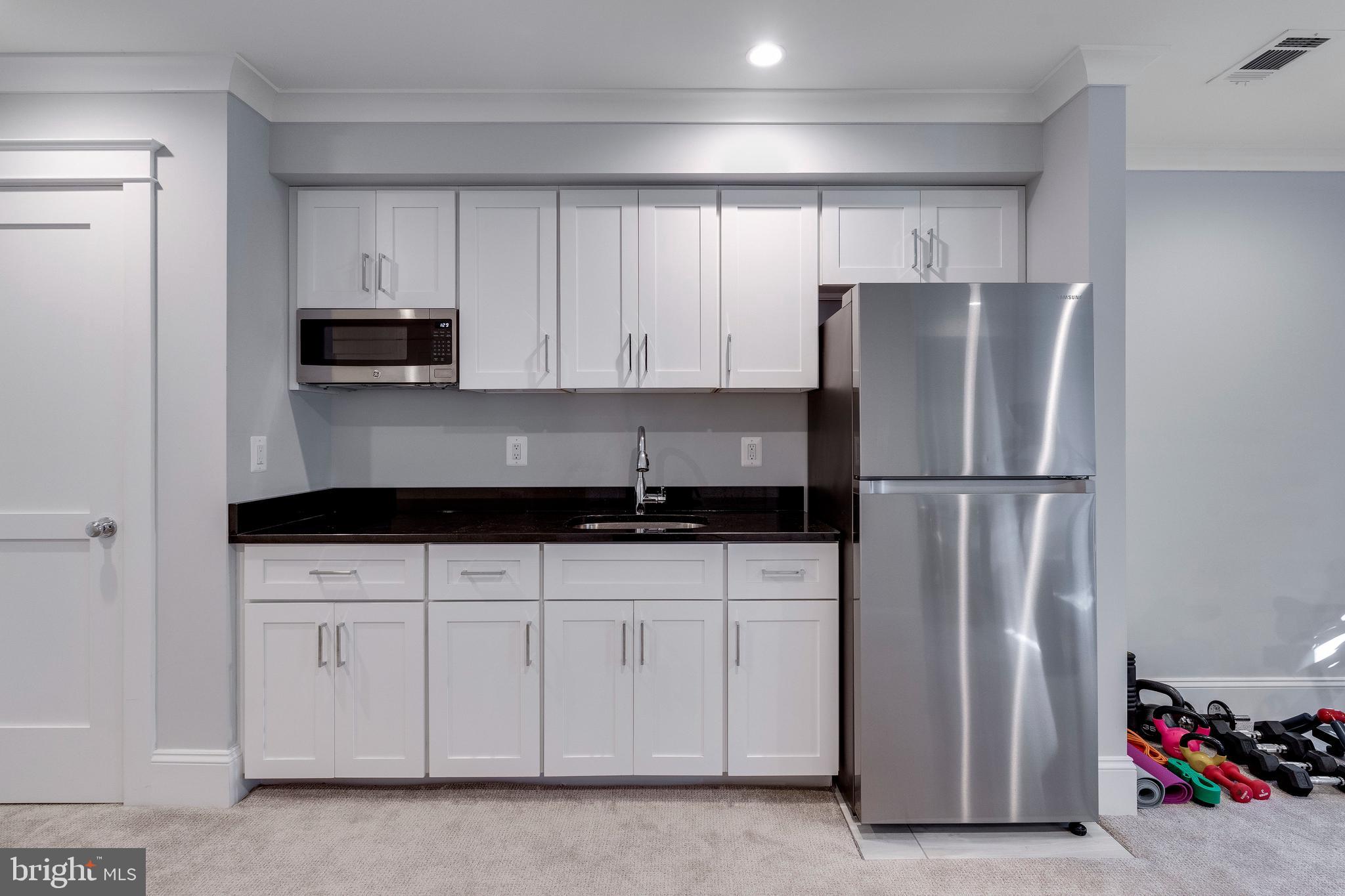 3616 T Street Northwest Washington, DC 20007 - Photo 41 of 49 a kitchen with stainless steel appliances granite countertop a refrigerator and a sink