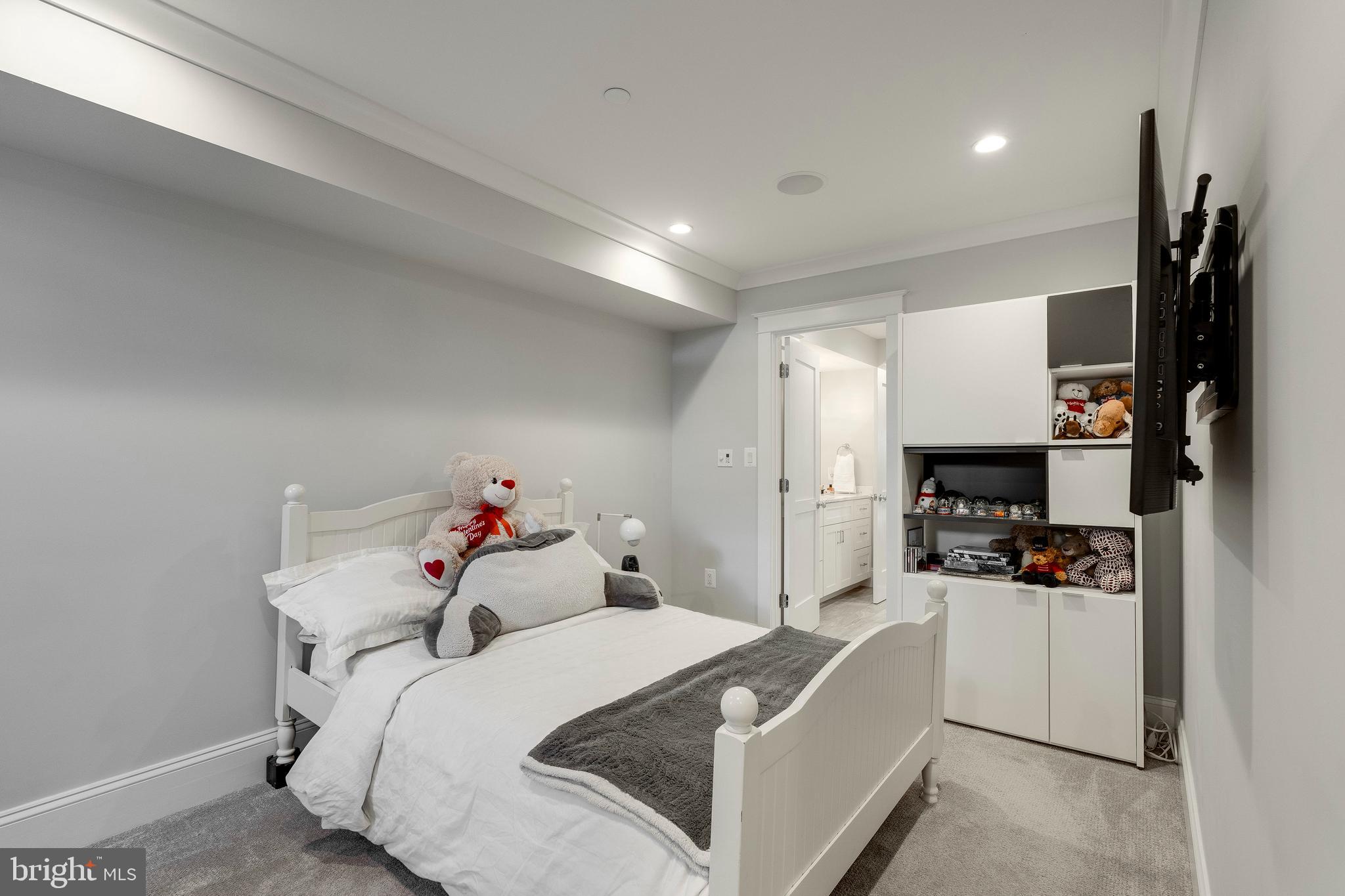 3616 T Street Northwest Washington, DC 20007 - Photo 43 of 49 a bedroom with a bed and a flat screen tv