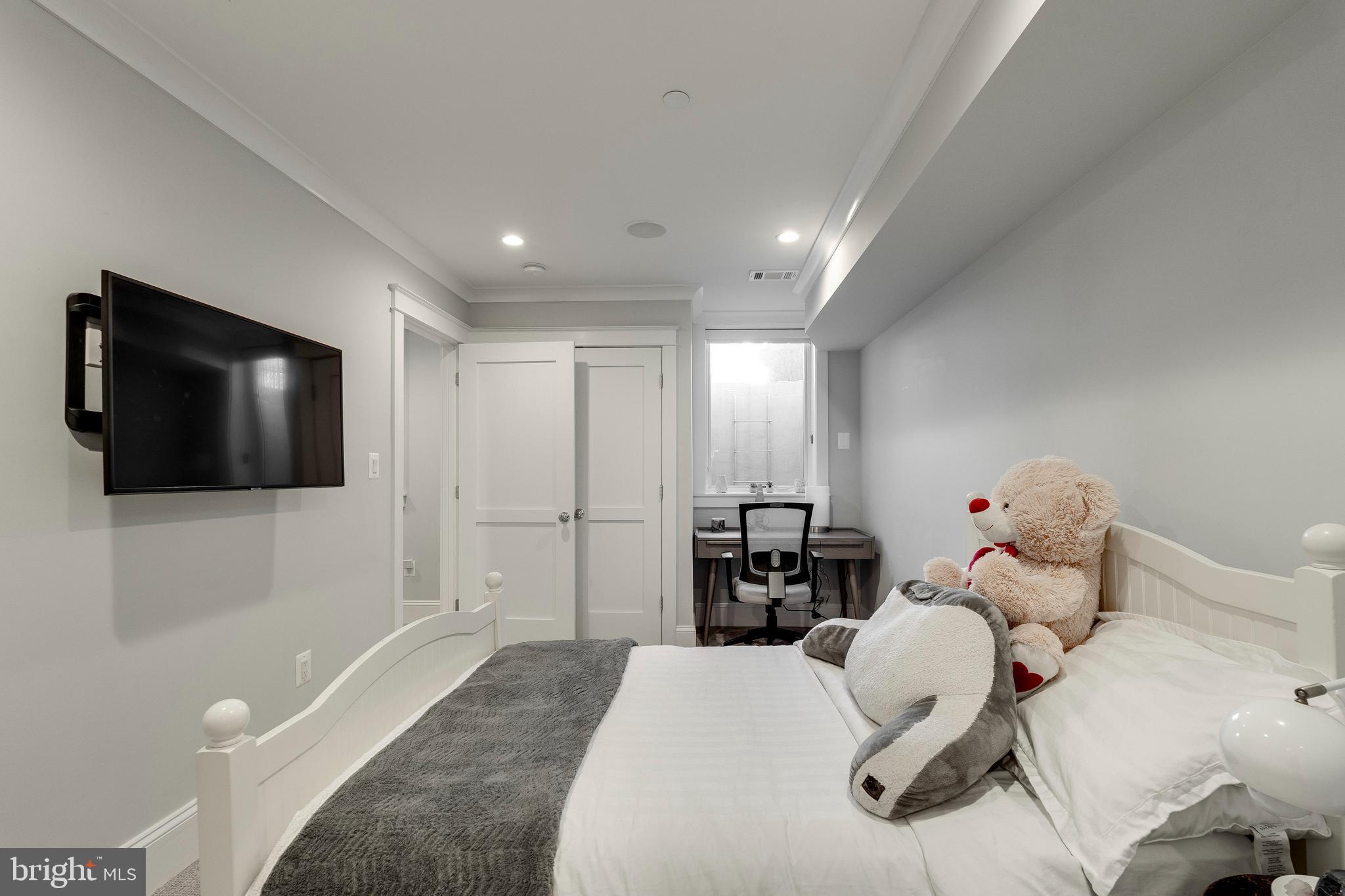 3616 T Street Northwest Washington, DC 20007 - Photo 44 of 49 a living room with furniture and a flat screen tv