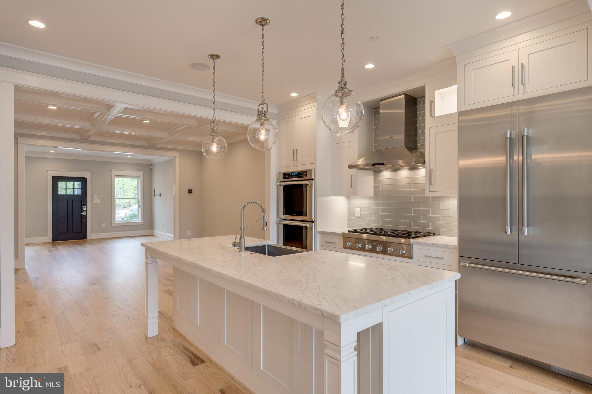3616 T Street Northwest Washington, DC 20007 - Photo 8 of 49 a kitchen with kitchen island a sink stove and refrigerator