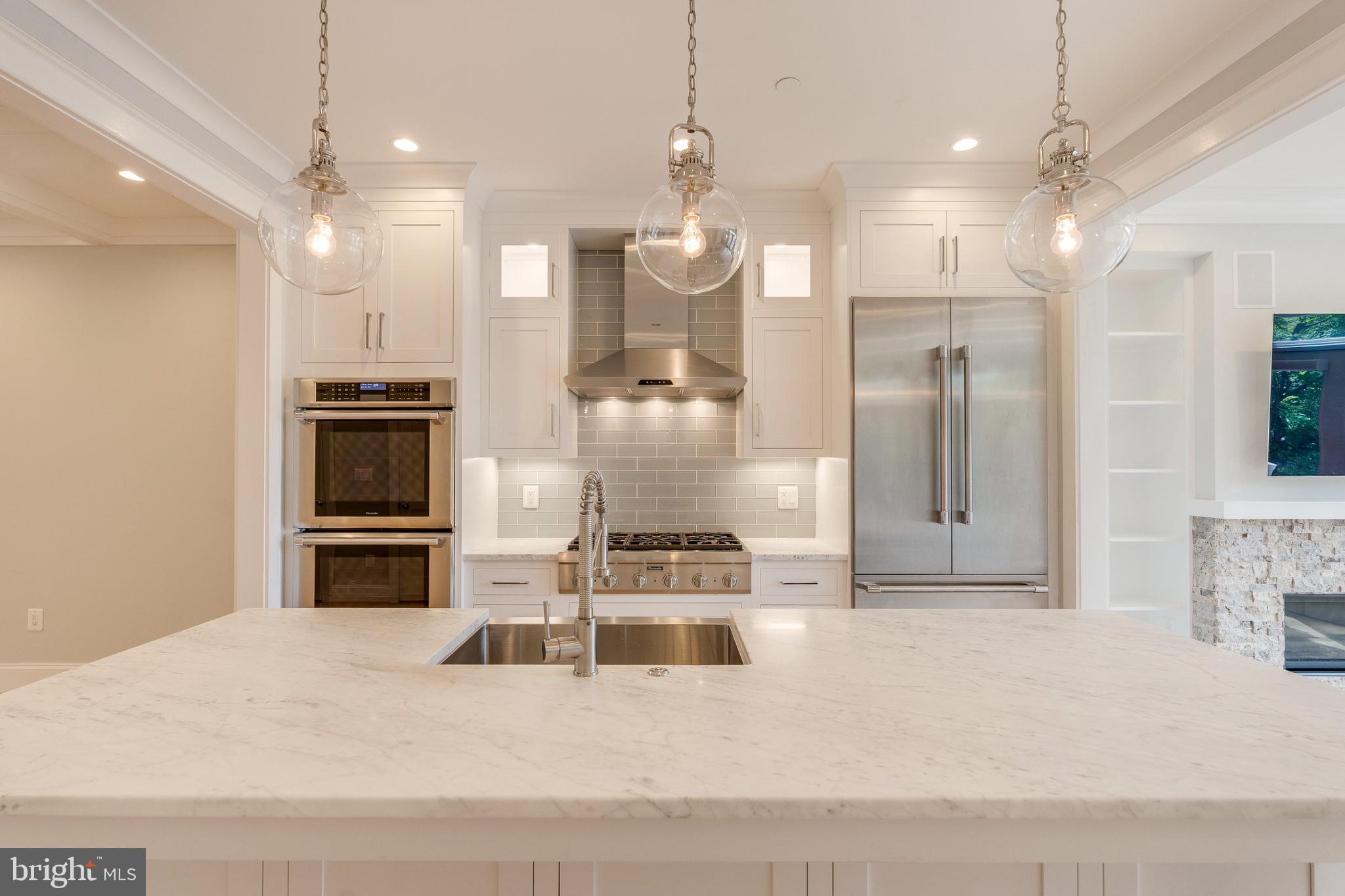 3616 T Street Northwest Washington, DC 20007 - Photo 9 of 49 a kitchen with kitchen island a sink stainless steel appliances and cabinets