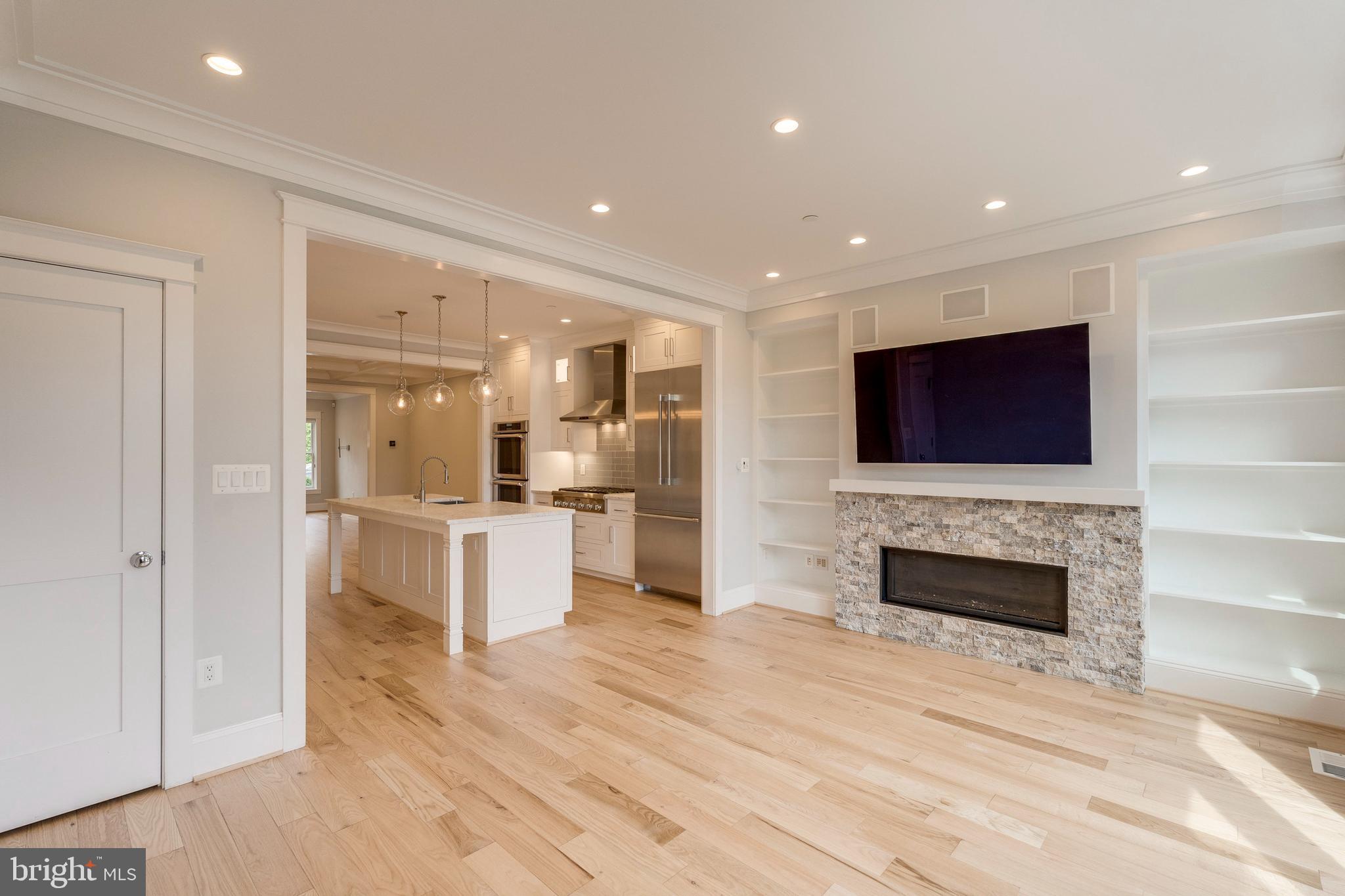 3616 T Street Northwest Washington, DC 20007 - Photo 10 of 49 a large white kitchen with stainless steel appliances kitchen island granite countertop a stove and a refrigerator