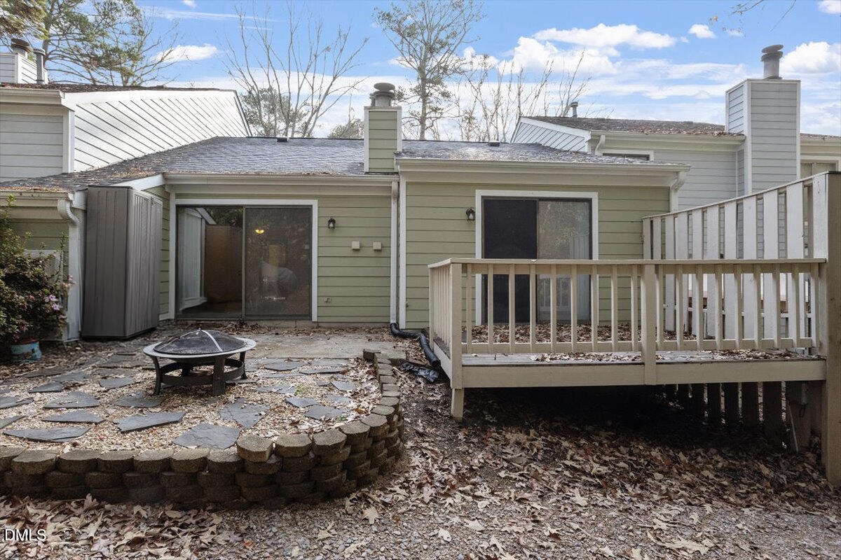 5867 Branchwood Road Raleigh, NC 27609 - Photo 14 of 24 a view of a chair and a table in backyard