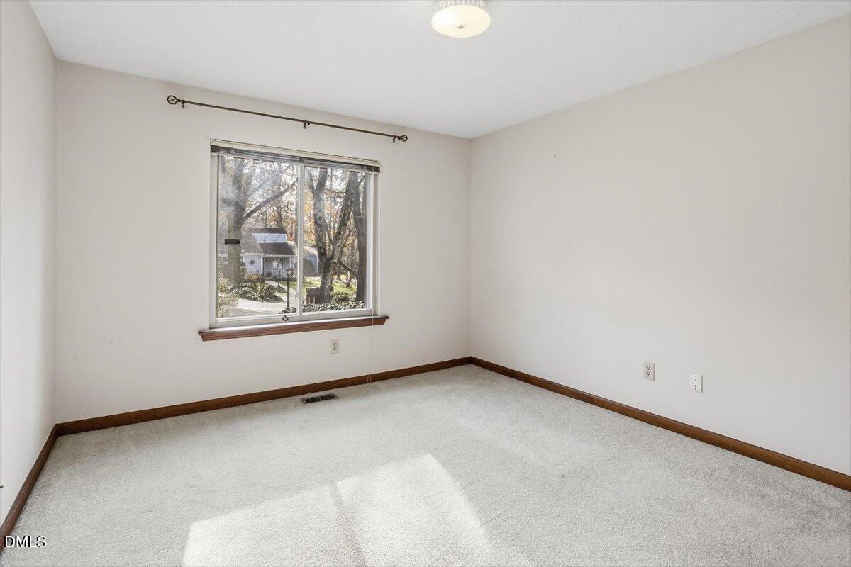 5867 Branchwood Road Raleigh, NC 27609 - Photo 16 of 24 an empty room with windows