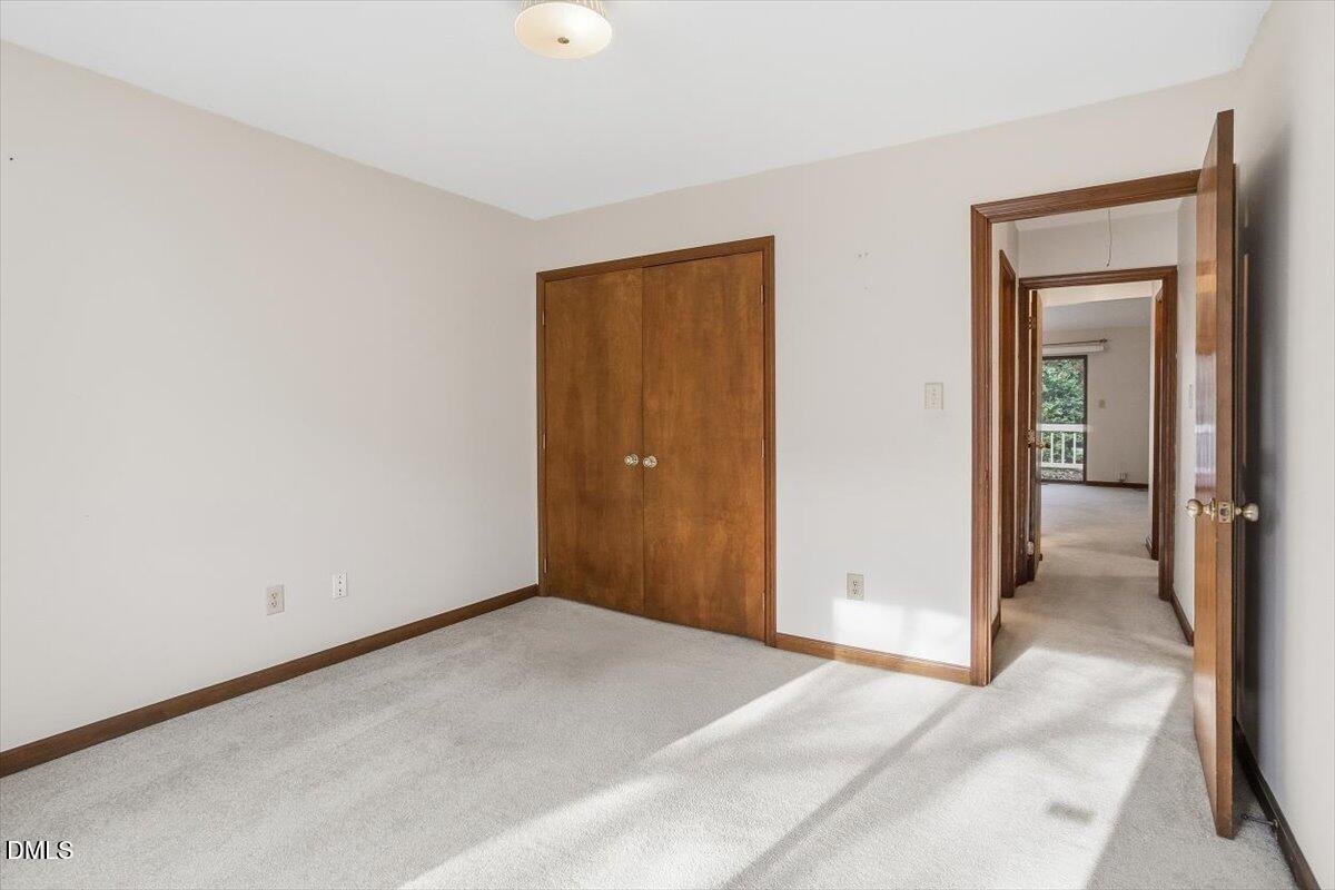 5867 Branchwood Road Raleigh, NC 27609 - Photo 17 of 24 an empty room with closet area