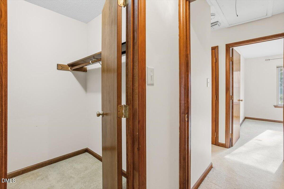 5867 Branchwood Road Raleigh, NC 27609 - Photo 19 of 24 a view of a room with a hallway
