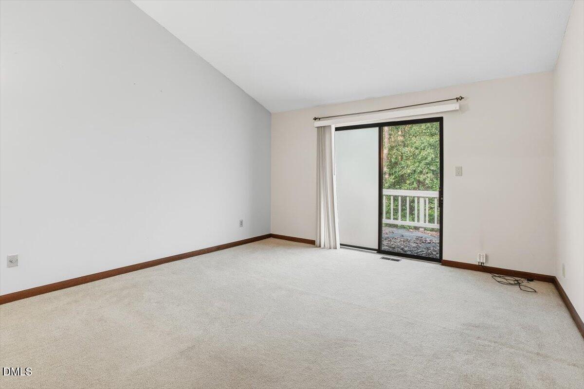 5867 Branchwood Road Raleigh, NC 27609 - Photo 21 of 24 a view of an empty room with a window