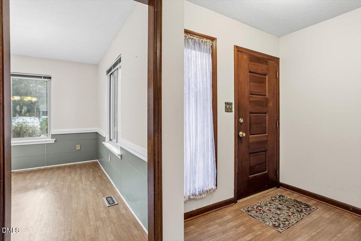 5867 Branchwood Road Raleigh, NC 27609 - Photo 4 of 24 an empty room with windows