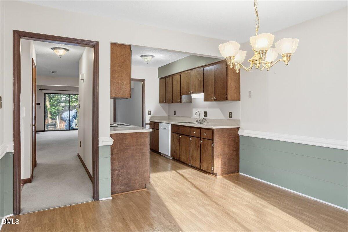 5867 Branchwood Road Raleigh, NC 27609 - Photo 7 of 24 a spacious bathroom with a granite countertop sink a mirror and a shower