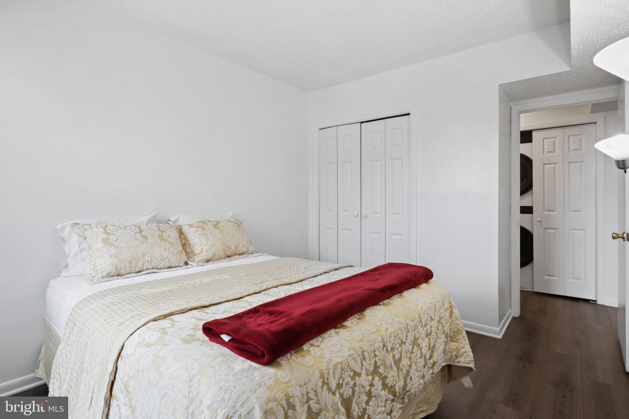 5505 Seminary Road, Unit 1306N Falls Church, VA 22041 - Photo 17 of 43 a bedroom with a bed and wooden floor