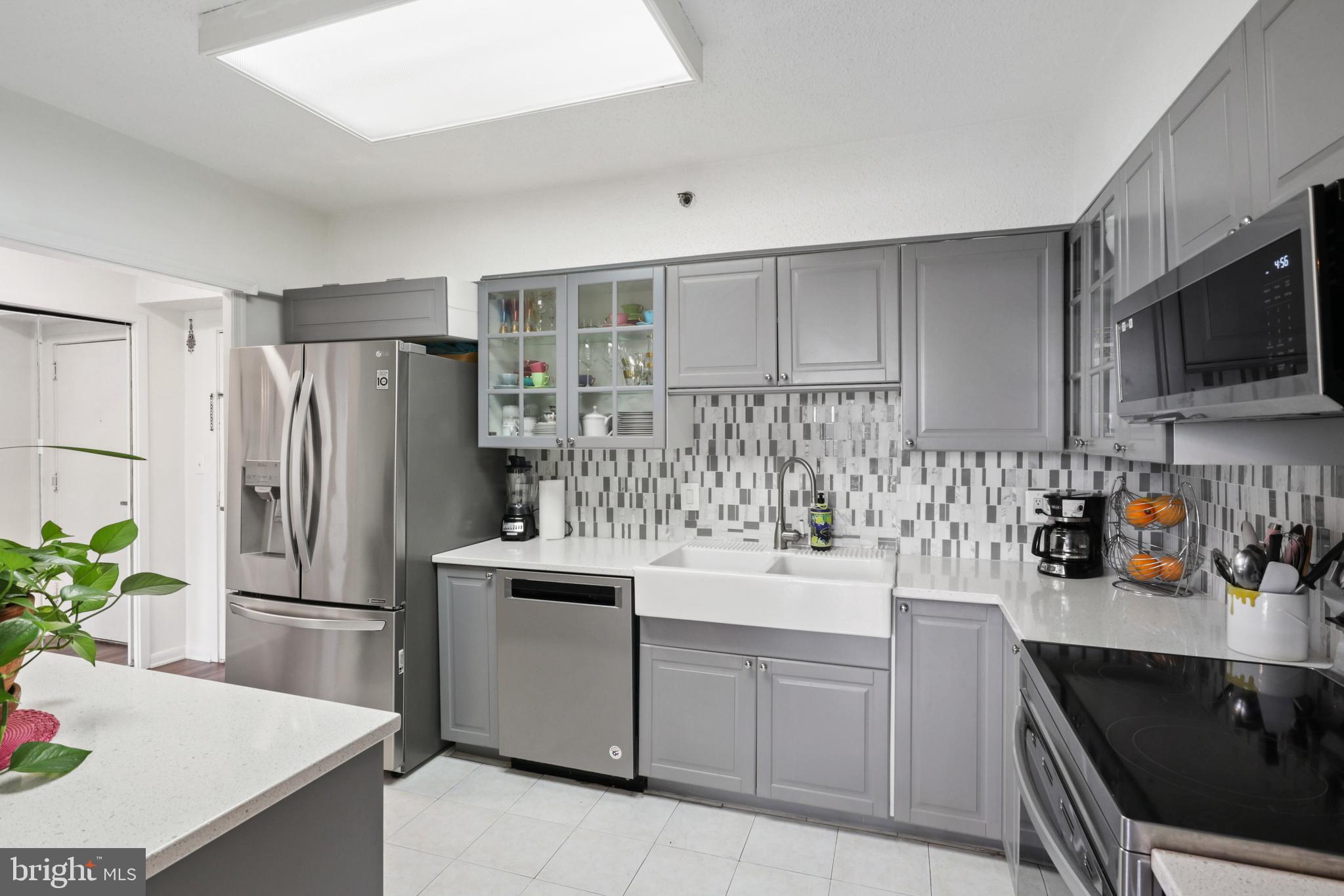 5505 Seminary Road, Unit 1306N Falls Church, VA 22041 - Photo 2 of 43 a kitchen with white cabinets and stainless steel appliances