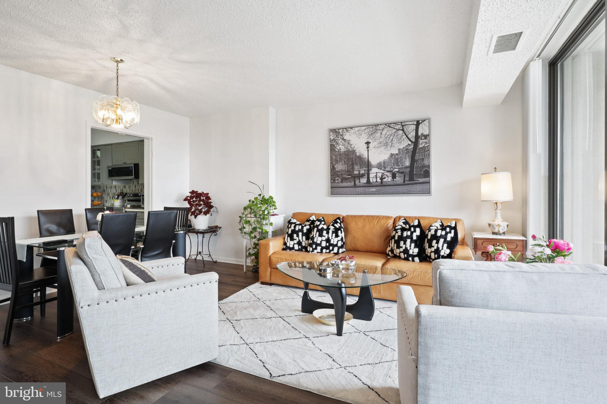 5505 Seminary Road, Unit 1306N Falls Church, VA 22041 - Photo 9 of 43 a living room with furniture and a chandelier