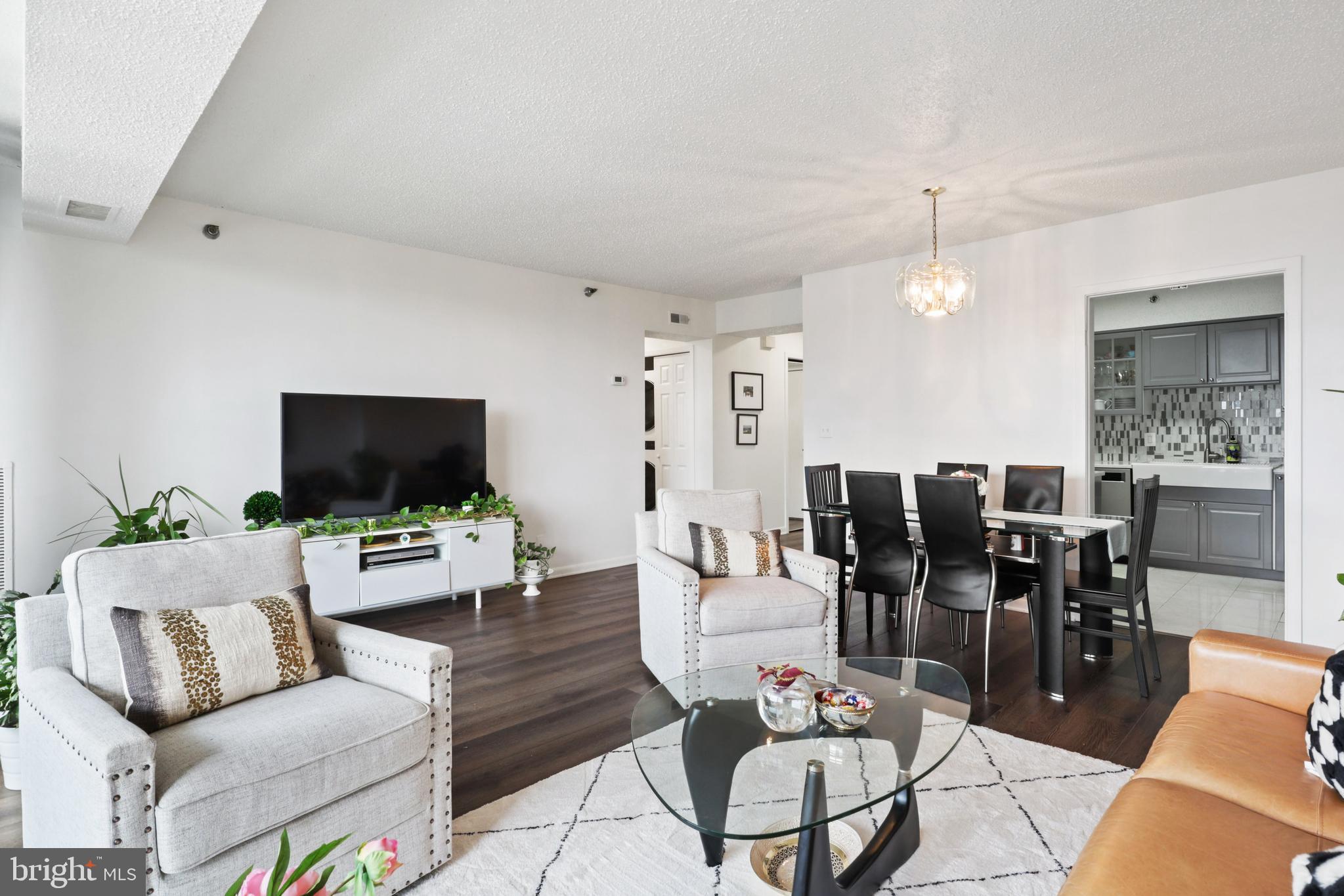 5505 Seminary Road, Unit 1306N Falls Church, VA 22041 - Photo 10 of 43 a living room with furniture and a flat screen tv