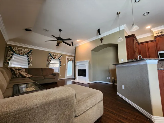 a bedroom with a bed and a ceiling fan