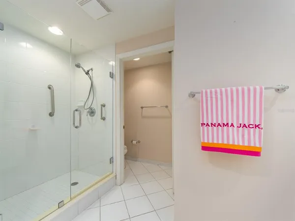 a bathroom with a shower and a sink