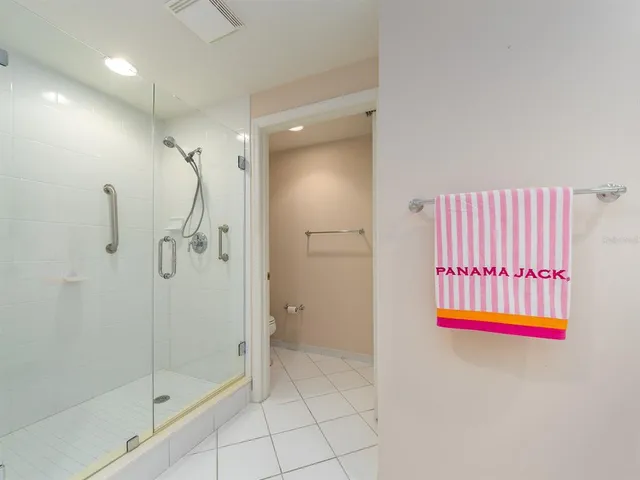 a bathroom with a shower and a sink