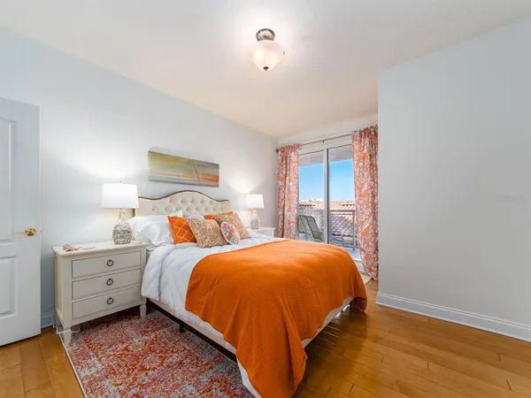 a bed room with a bed and a window