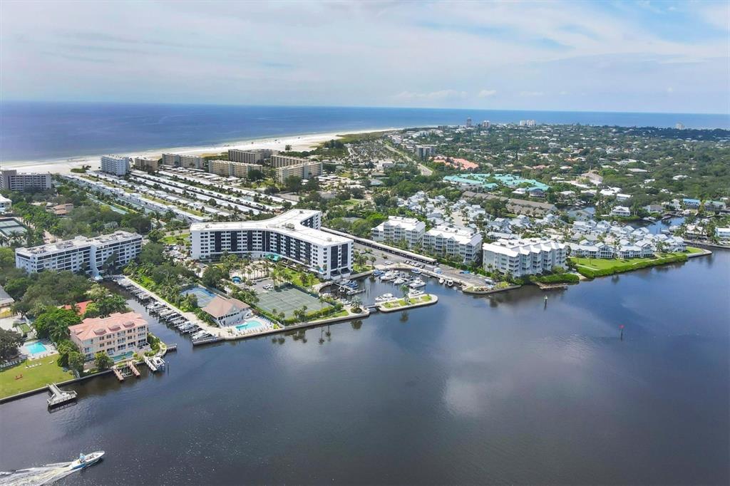 5855 Midnight Pass Road, Unit 420 Sarasota, FL 34242 - Photo 28 of 53 an aerial view of multiple house