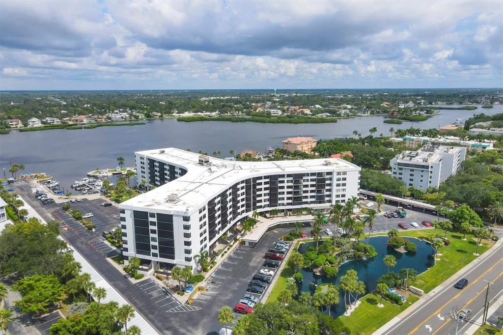 5855 Midnight Pass Road, Unit 420 Sarasota, FL 34242 - Photo 3 of 53 a view of a city with tall buildings