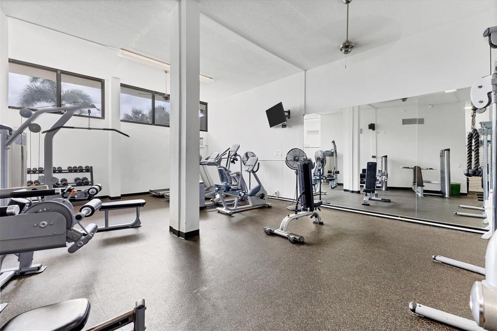 5855 Midnight Pass Road, Unit 420 Sarasota, FL 34242 - Photo 34 of 53 a view of a room with gym equipment