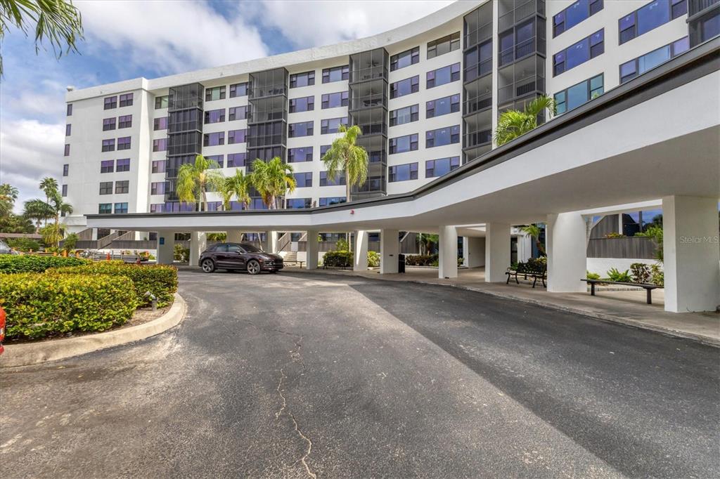 5855 Midnight Pass Road, Unit 420 Sarasota, FL 34242 - Photo 4 of 53 a view of building along with street