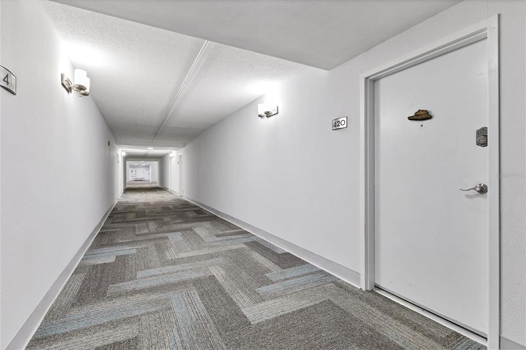5855 Midnight Pass Road, Unit 420 Sarasota, FL 34242 - Photo 5 of 53 a view of a hallway